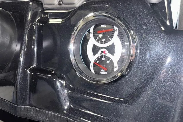 Slide: The Image of Dashboard gauges of 2026 Xpress H20 Bass boat, showing fuel and pressure levels. - 18