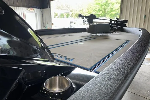 Slide: The Image of 2026 Xpress H20 Bass boat interior with SeaDek flooring in a garage setting. - 20