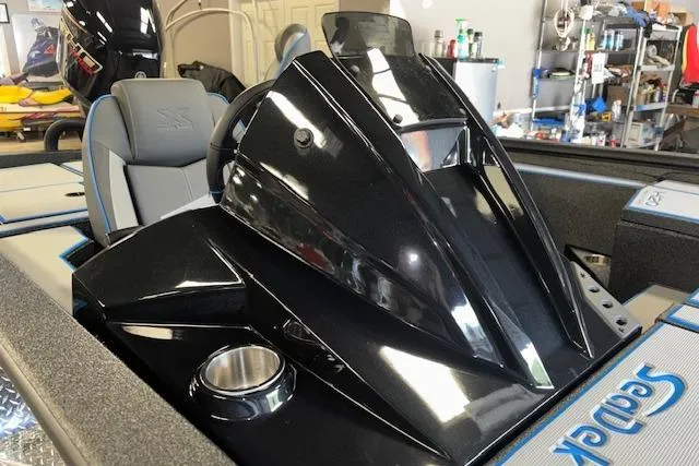 Slide: The Image of 2026 Xpress H20 Bass boat interior with sleek black console and seating. - 21