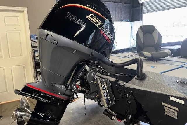 Slide: The Image of 2026 Xpress H20 Bass boat with Yamaha engine in a garage setting. - 27