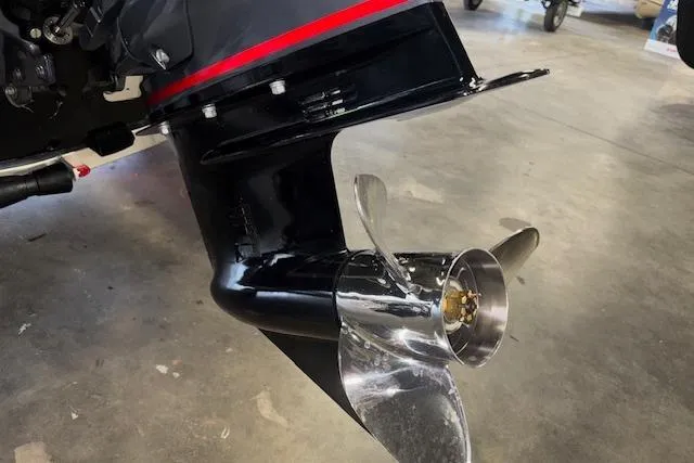 Slide: The Image of 2026 Xpress H20 Bass boat propeller and motor detail in a garage setting. - 29