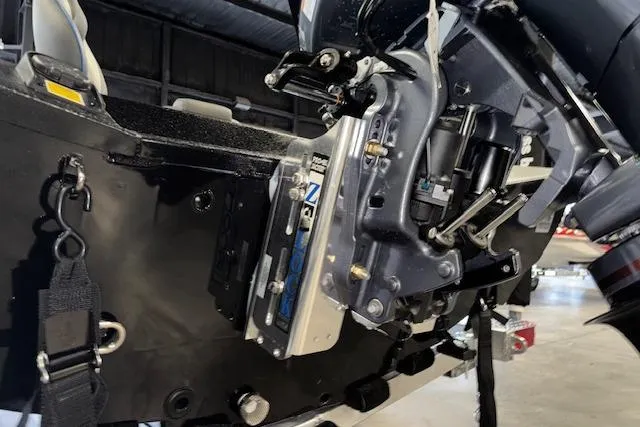 Slide: The Image of 2026 Xpress H20 Bass boat engine close-up in a garage setting. - 30