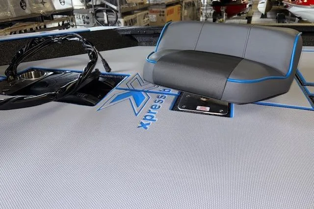 Slide: The Image of 2026 Xpress H20 Bass boat interior with steering wheel and seating. - 6