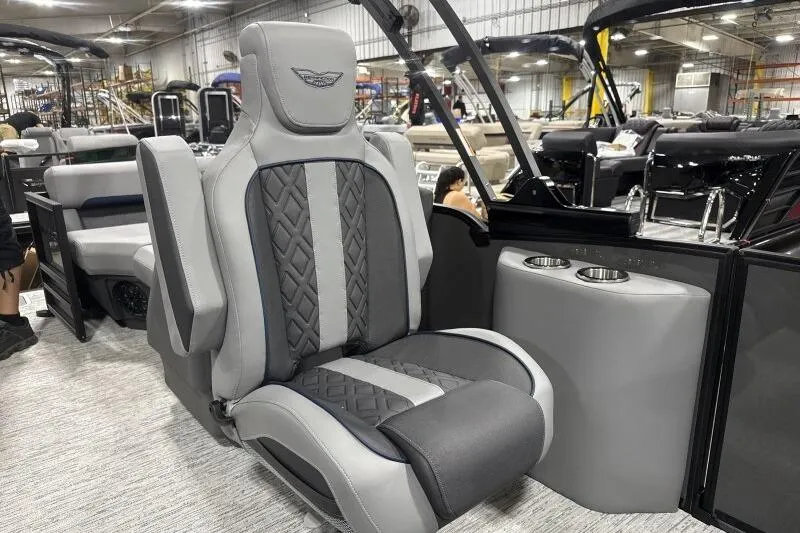 Slide: The Image of Luxurious seating on 2026 Bennington 24 MFBSF pontoon boat, featuring elegant design and cup holders. - 13