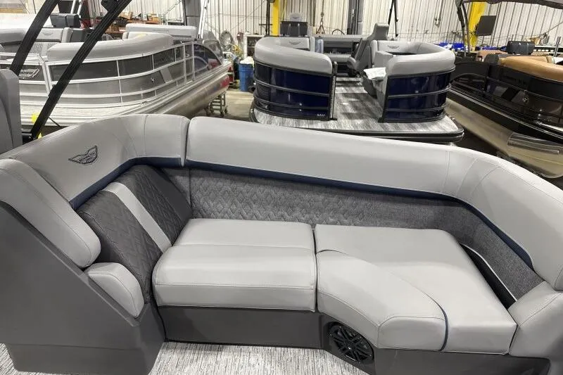 Slide: The Image of 2026 Bennington 24 MFBSF pontoon boat interior with luxurious gray seating. - 19