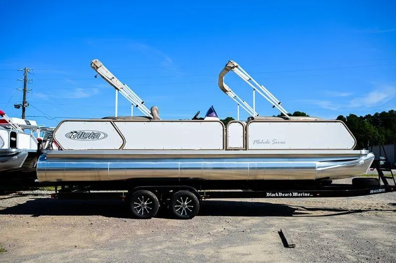 The Image of 2023 Aloha Pontoon Mahalo 23 on trailer, side view, under clear blue sky. - 0