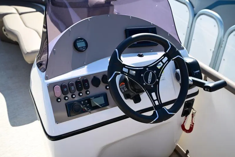 Slide: The Image of Steering console of 2023 Aloha Pontoon Mahalo 23 with modern controls and dashboard. - 5