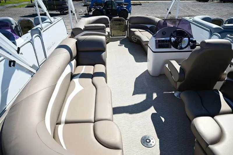 Slide: The Image of 2023 Aloha Pontoon Mahalo 23 interior with spacious seating and modern helm. - 6