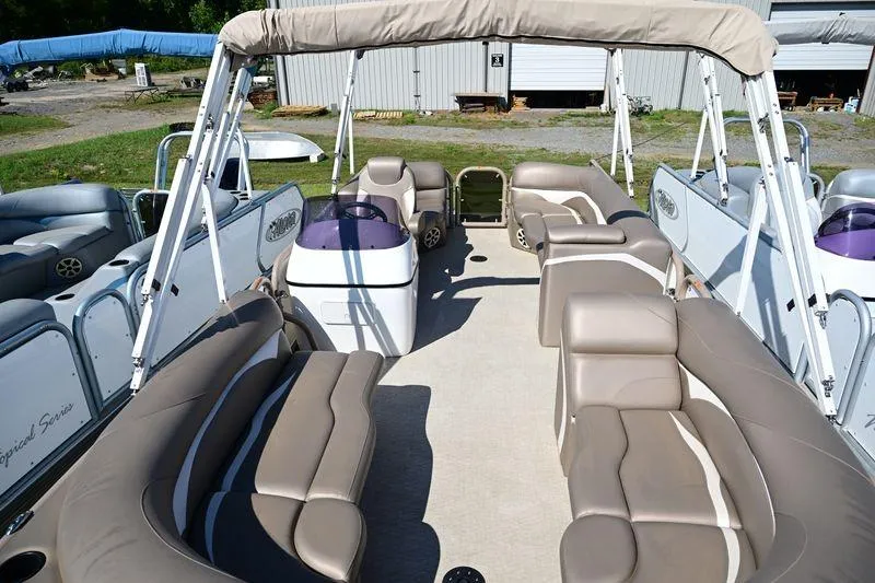 Slide: The Image of 2023 Aloha Pontoon Mahalo 23 with spacious seating and canopy, docked outdoors. - 8