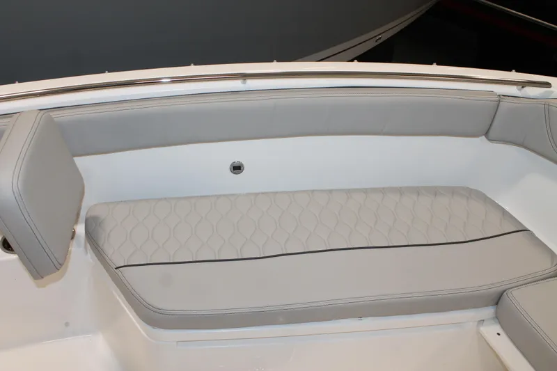 Slide: The Image of 2026 Pursuit S 268 Sport boat interior with gray cushioned seating. - 21