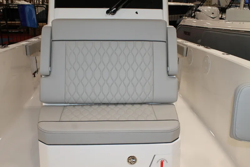 Slide: The Image of 2026 Pursuit S 268 Sport boat with luxurious gray seating and diamond stitching. - 22