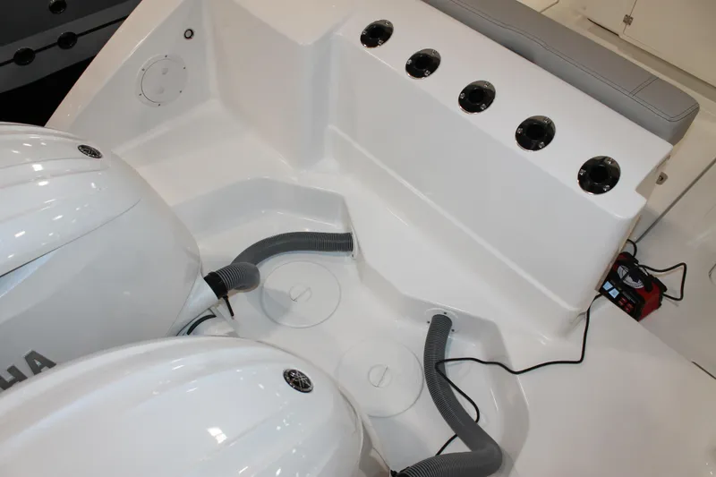 Slide: The Image of 2026 Pursuit S 268 Sport boat interior with dual engines and seating area. - 26