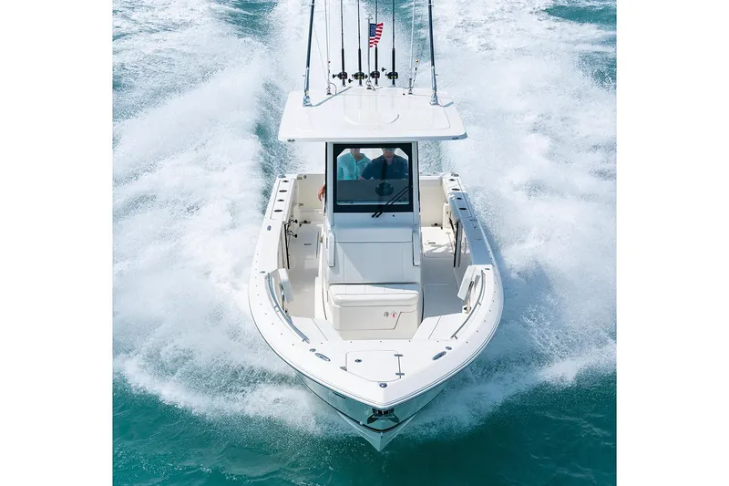 Slide: The Image of Manufacturer Provided Image: 2025 Pursuit S 268 Sport boat cruising on open water. - 2