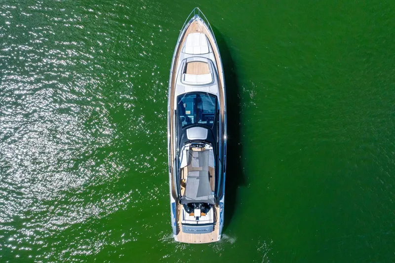 Slide: The Image of Aerial view of 2023 Riva 76 PERSEO Super yacht on green water. - 11