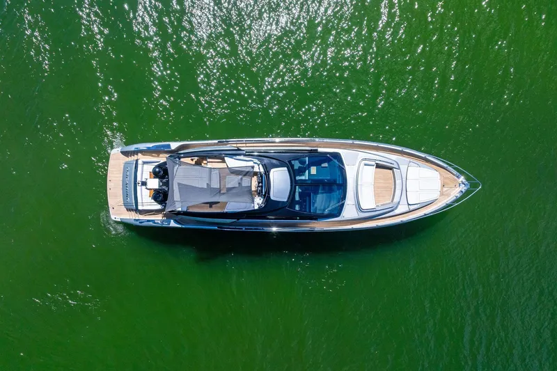 Slide: The Image of Aerial view of 2023 Riva 76 PERSEO Super yacht on vibrant green water. - 16