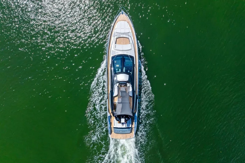 Slide: The Image of Aerial view of 2023 Riva 76 PERSEO Super yacht cruising on green water. - 17