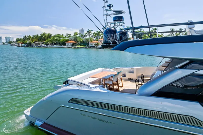 Slide: The Image of Luxury 2023 Riva 76 PERSEO Super yacht docked by tropical waterfront homes. - 19