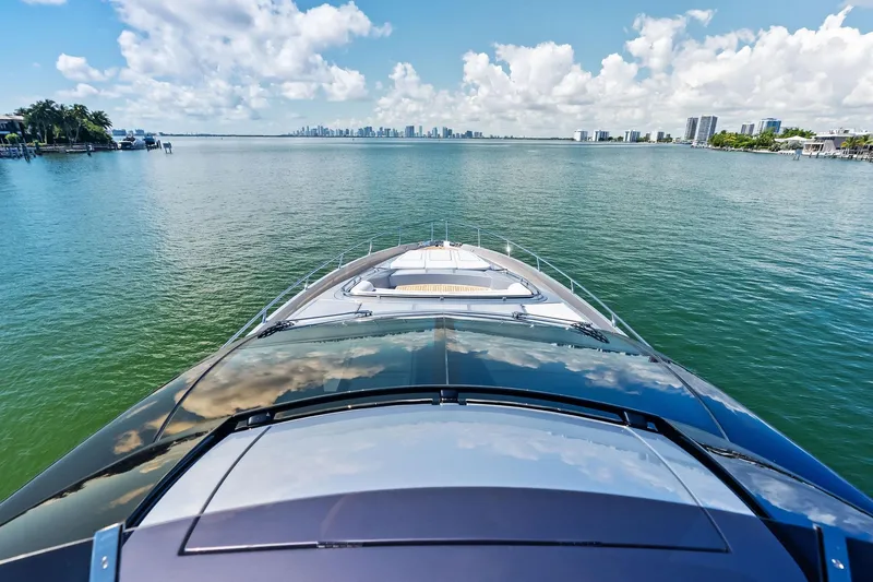 Slide: The Image of Luxurious 2023 Riva 76 PERSEO Super yacht cruising on serene waters under a blue sky. - 29