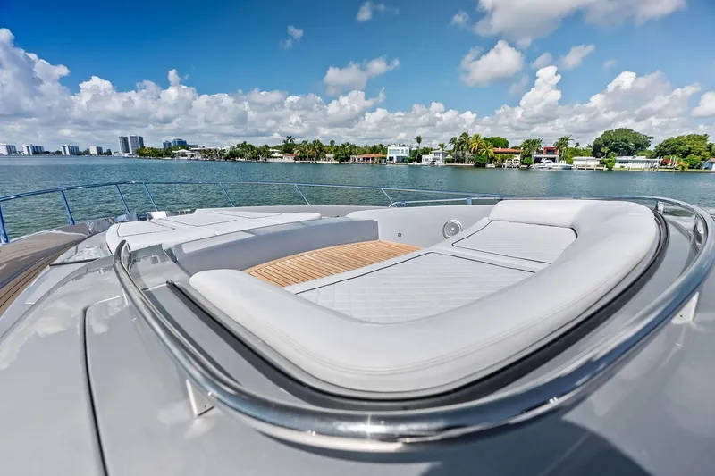 Slide: The Image of Luxurious 2023 Riva 76 PERSEO Super yacht with elegant deck seating, overlooking serene waters. - 32