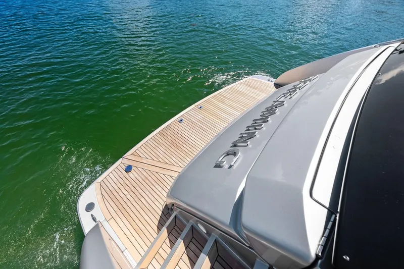 Slide: The Image of Riva 76 PERSEO Super 2023 yacht with sleek deck design on calm water. - 35