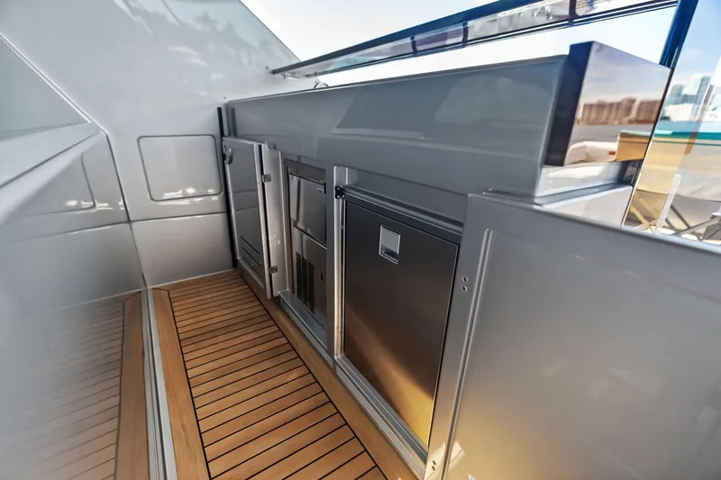 Slide: The Image of Luxurious 2023 Riva 76 PERSEO Super yacht interior with sleek cabinetry and wooden flooring. - 40