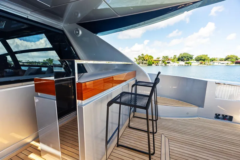 Slide: The Image of Luxury deck of 2023 Riva 76 PERSEO Super yacht with modern seating and scenic view. - 41