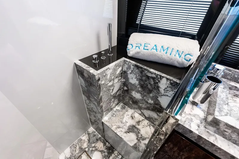 Slide: The Image of Luxurious marble bathroom in 2023 Riva 76 PERSEO Super yacht, featuring elegant fixtures and "Dreaming" towel. - 75
