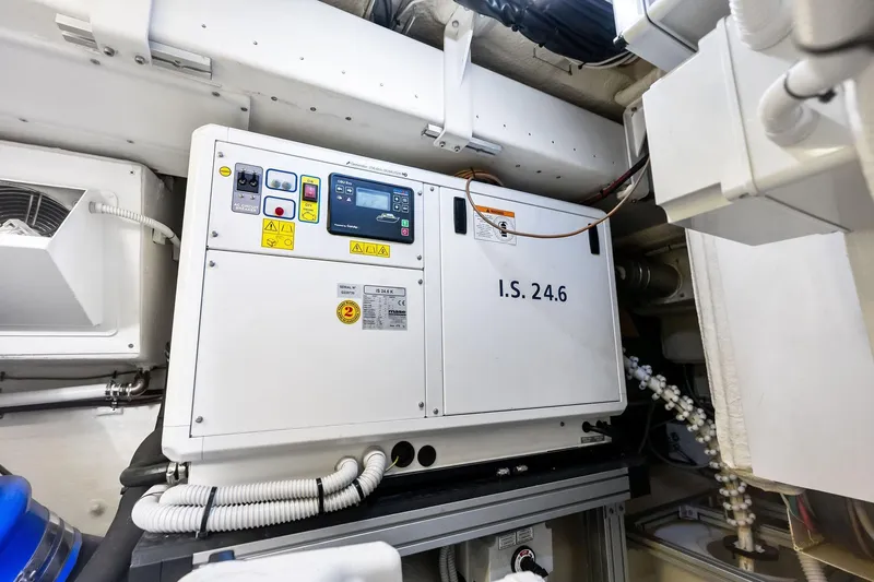 Slide: The Image of Engine room of 2023 Riva 76 PERSEO Super yacht, featuring control panel and wiring. - 83