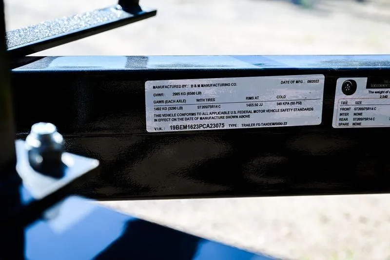 Slide: The Image of Label on Aloha Pontoon Mahalo 23 trailer, displaying manufacturing and safety details. - 12