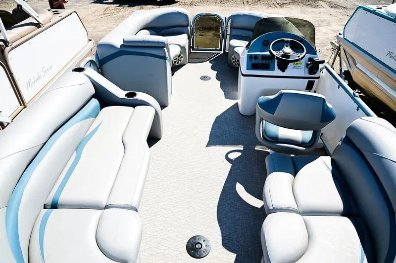 Slide: The Image of 2023 Aloha Pontoon Mahalo 23 interior with spacious seating and modern helm. - 7