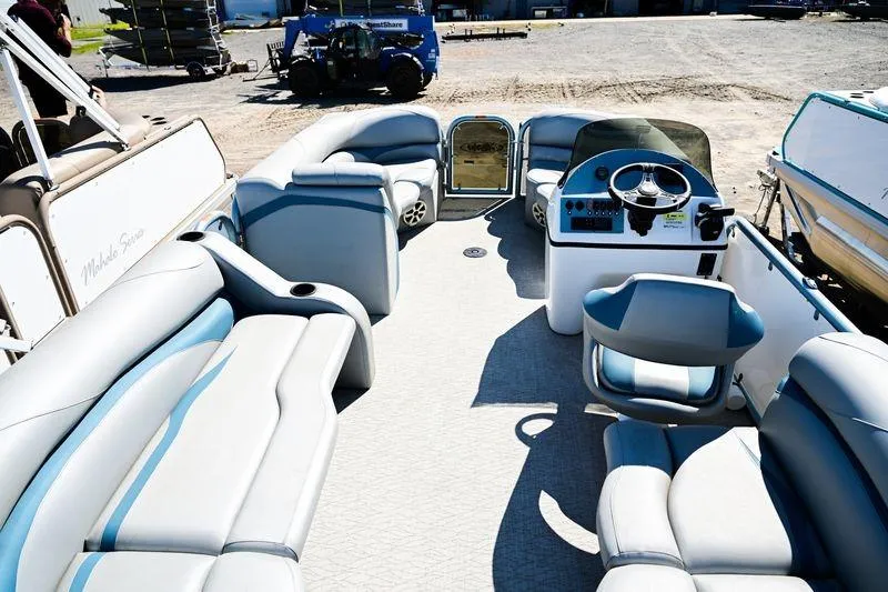 Slide: The Image of 2023 Aloha Pontoon Mahalo 23 interior with spacious seating and modern helm. - 8