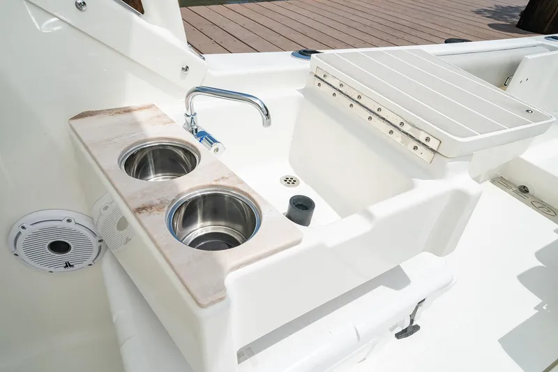 Slide: The Image of 2026 Pursuit DC 246 Dual Console boat interior with luxurious seating and modern design. - 11