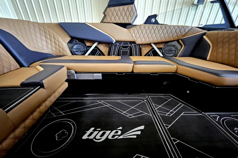 Slide: The Image of Luxurious interior of 2025 Tigé 22RZX boat with elegant seating and stylish design. - 12