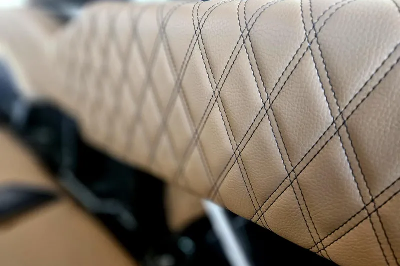 Slide: The Image of Luxurious diamond-stitched leather upholstery in 2025 Tigé 22RZX boat interior. - 24