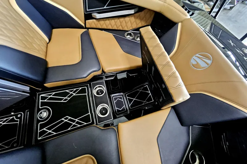 Slide: The Image of Luxurious interior of 2025 Tigé 22RZX boat with tan and black seating. - 4