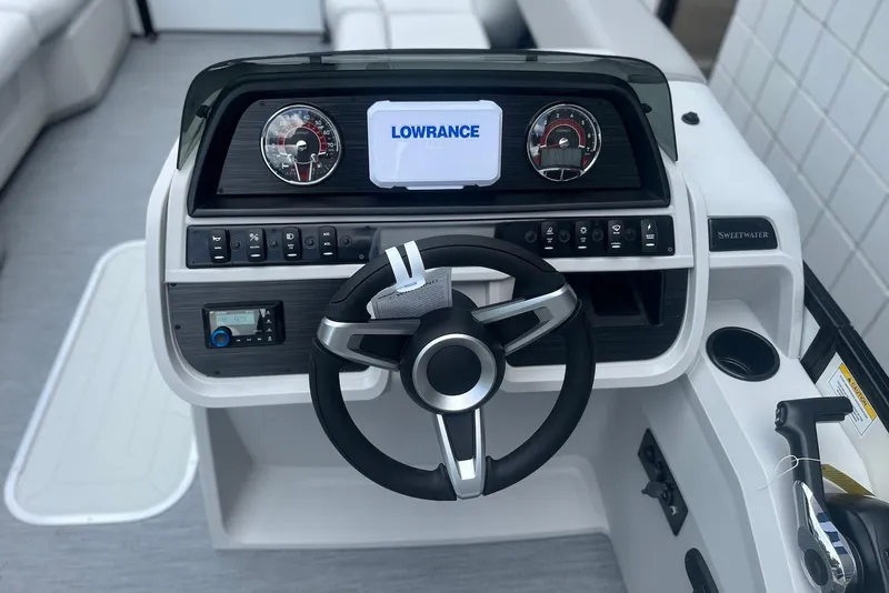 Slide: The Image of Steering console of 2026 Godfrey SWEETWATER 2286 SFL with Lowrance display and modern controls. - 16