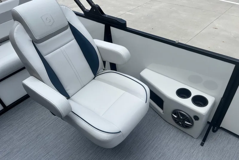 Slide: The Image of Luxury seating on 2026 Godfrey SWEETWATER 2286 SFL boat with cup holders and speaker. - 17