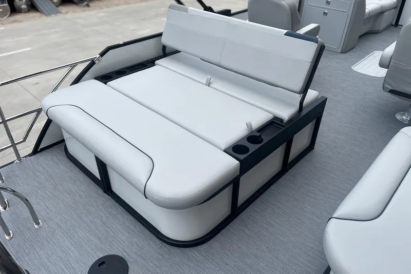 Slide: The Image of 2026 Godfrey SWEETWATER 2286 SFL boat interior with sleek white seating and cup holders. - 20