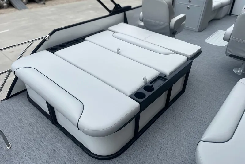 Slide: The Image of Luxurious seating on 2026 Godfrey SWEETWATER 2286 SFL pontoon boat, featuring cup holders. - 21