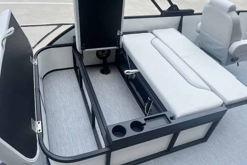 Slide: The Image of 2026 Godfrey SWEETWATER 2286 SFL boat interior with open storage and seating. - 23