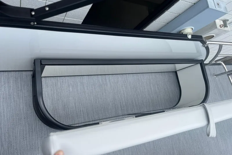 Slide: The Image of 2026 Godfrey SWEETWATER 2286 SFL boat interior with sleek railing and modern design. - 26