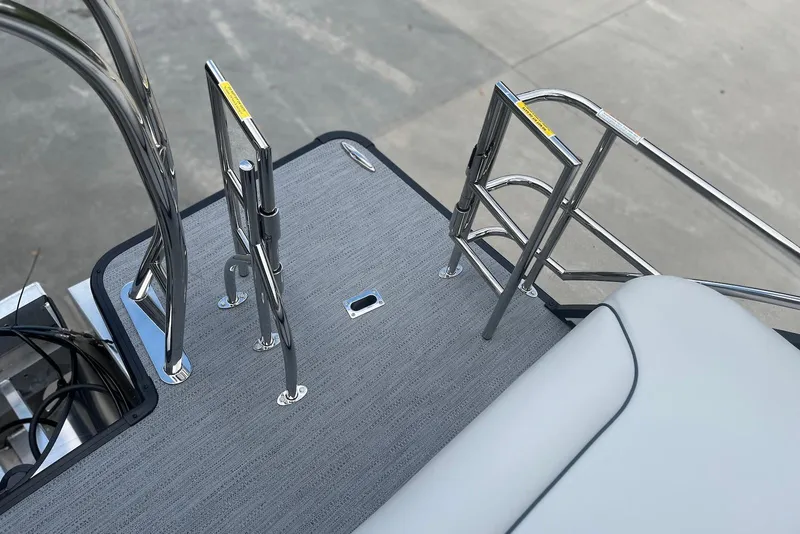 Slide: The Image of 2026 Godfrey SWEETWATER 2286 SFL boat deck with stainless steel ladder and railing. - 28