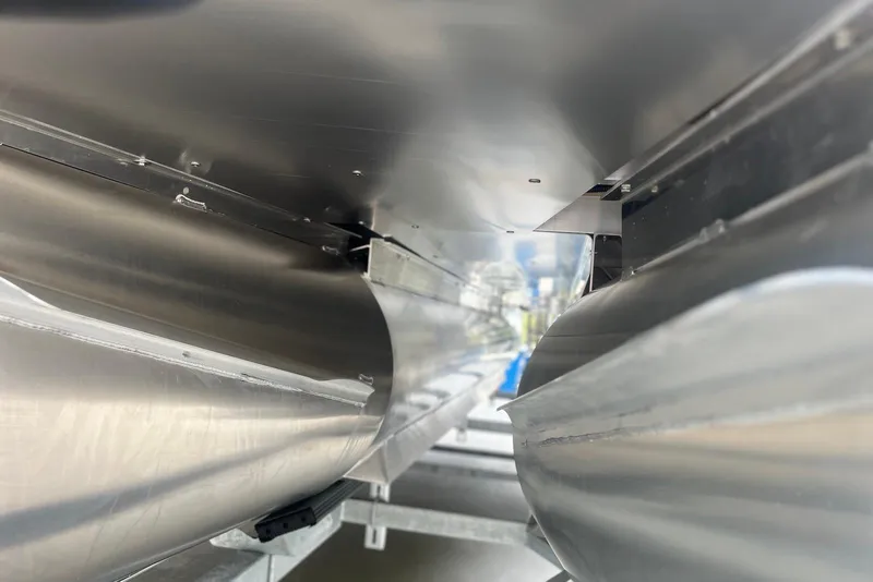 Slide: The Image of Underneath view of 2026 Godfrey SWEETWATER 2286 SFL pontoon boat, showcasing sleek aluminum pontoons. - 32