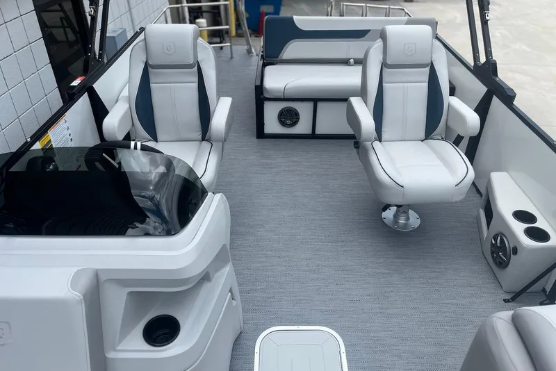 Slide: The Image of 2026 Godfrey SWEETWATER 2286 SFL boat interior with plush seating and modern design. - 7