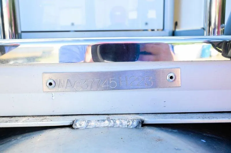 Slide: The Image of Close-up of a 2023 Aloha Pontoon Mahalo 23 serial number plate. - 12