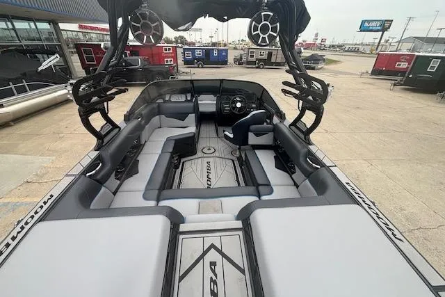 Slide: The Image of 2022 Moomba Kaiyen boat interior with spacious seating and modern design. - 13