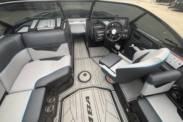 Slide: The Image of 2022 Moomba Kaiyen boat interior with modern seating and dashboard design. - 16