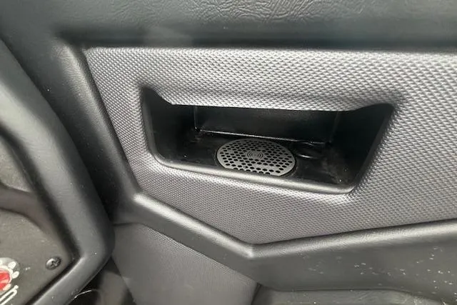 Slide: The Image of Interior detail of a 2022 Moomba Kaiyen boat, featuring a textured storage compartment. - 19