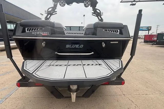 Slide: The Image of 2022 Moomba Kaiyen boat rear view with swim platform and speakers. - 2