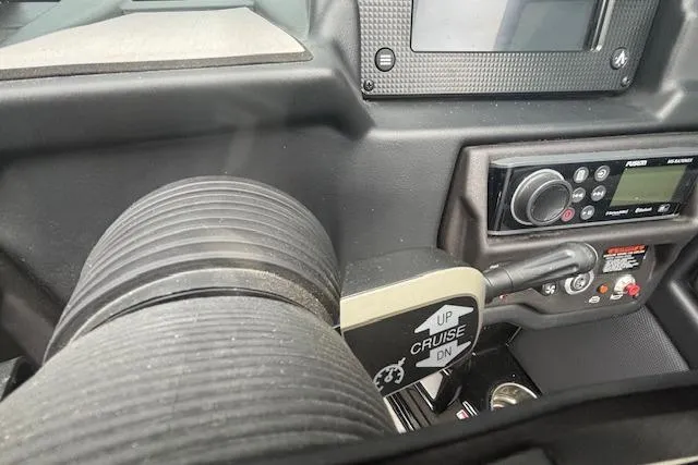 Slide: The Image of Dashboard of a 2022 Moomba Kaiyen boat with cruise control and audio controls. - 24